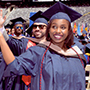 Graduates process into the stadium