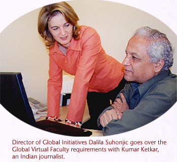 Director of Global Initiatives Dalila Suhonjic goes over the Global Virtual Faculty requirements with Kumar Ketkar, an Indian journalist.