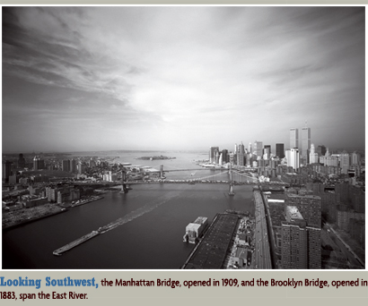 Looking Southwest, the Manhattan Bridge, opened in 1909, and the Brooklyn Bridge, opened in 1883, span the East River.